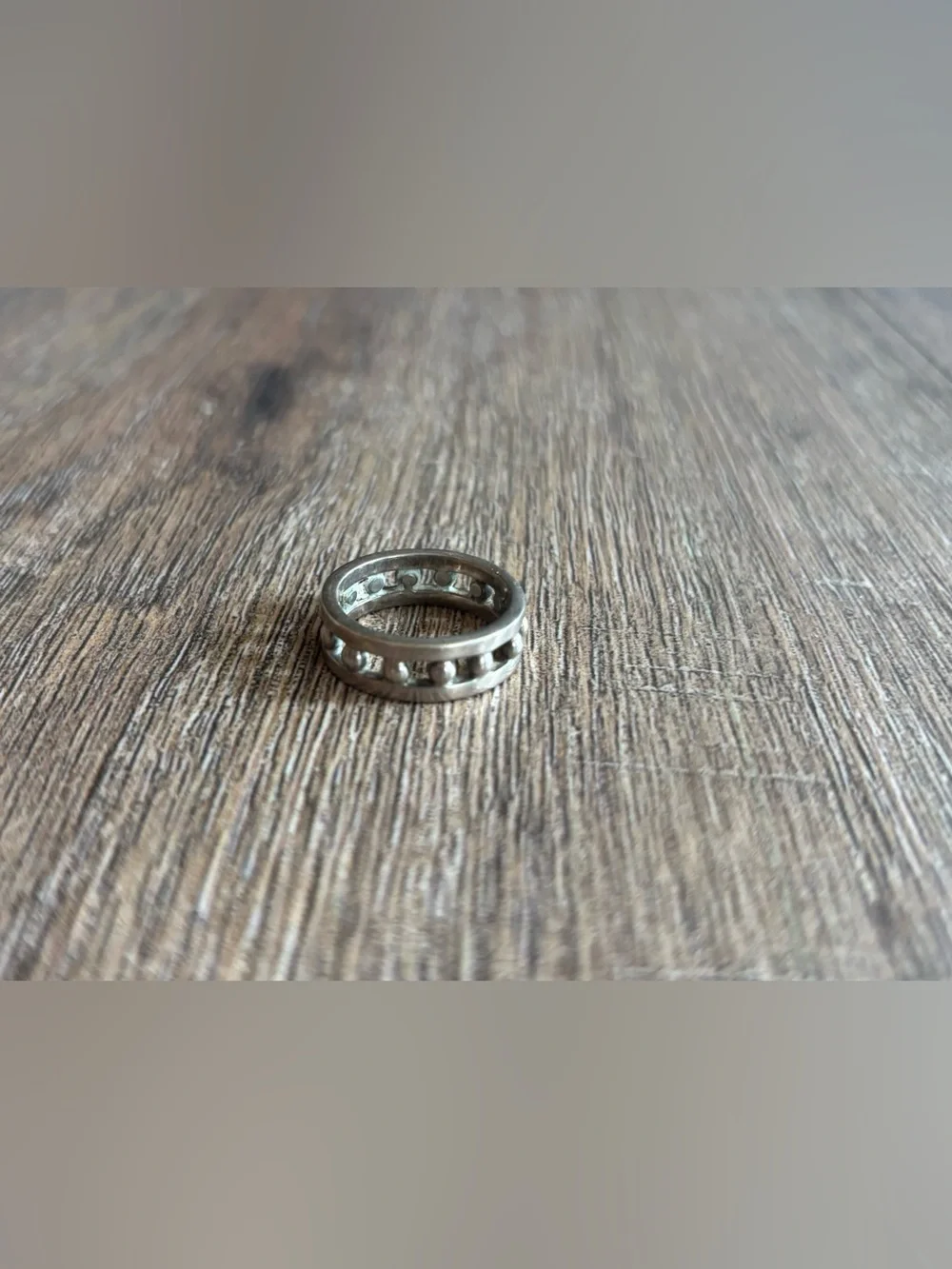 Women’s size 11.5 silver-toned metal ball bearing or studded channel band ring